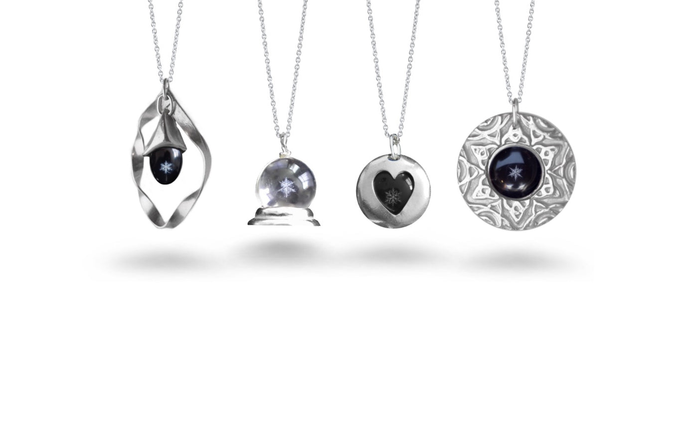Snowglobe Jewelry Collection. Real snowflakes mounted on Sterling Silver pendants.